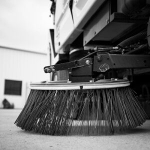 Gutter broom of sweeping truck close up