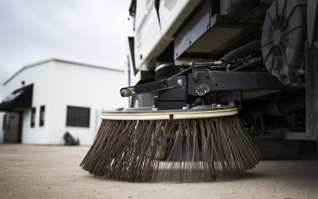Close up of Gutter Broom on sweeper truck